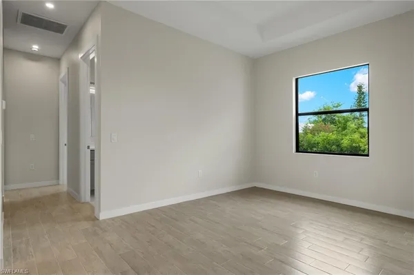 a view of an empty room with a window