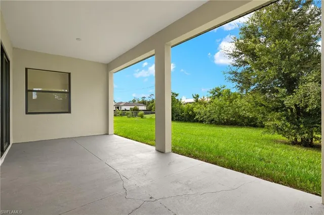 a view of a garden and an empty room