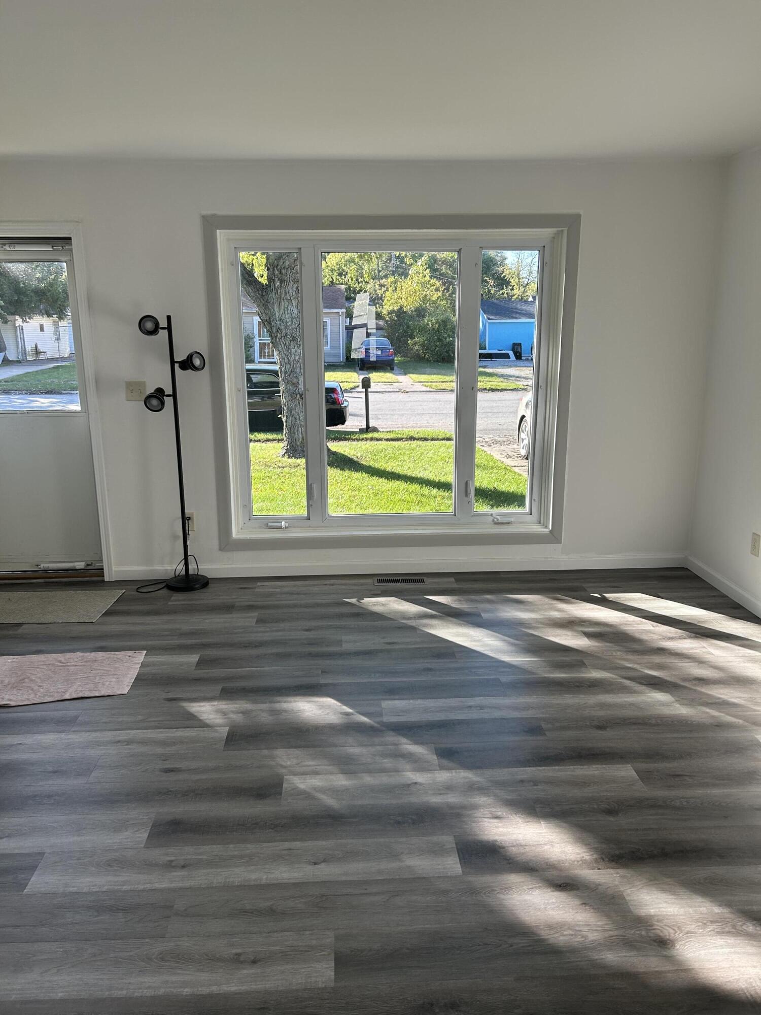 511 South Wayne Street Gary, IN 46403 - Photo 2 of 15 a view of a room that has a bed and a window