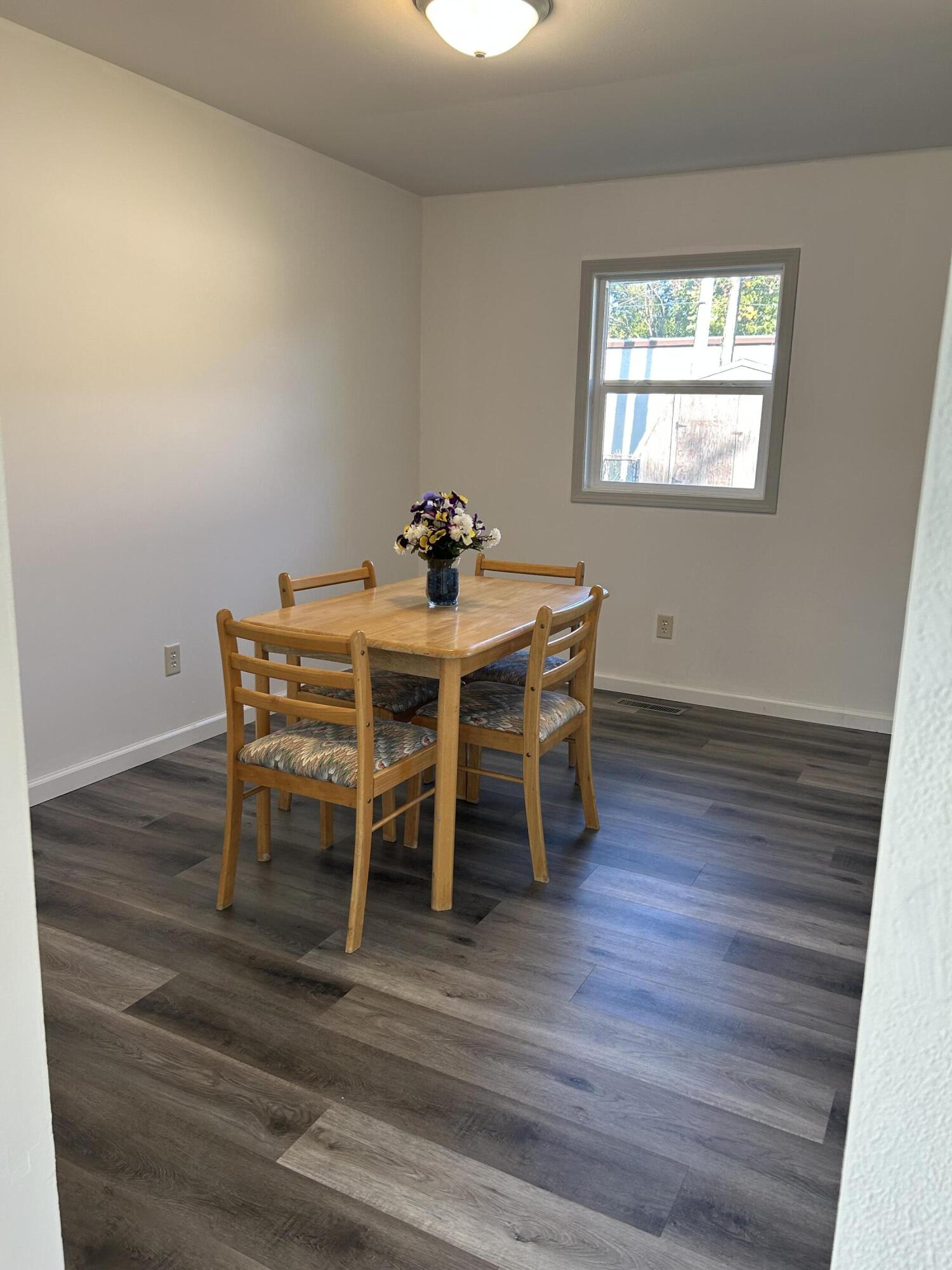511 South Wayne Street Gary, IN 46403 - Photo 7 of 15 a dining room with furniture and wooden floor