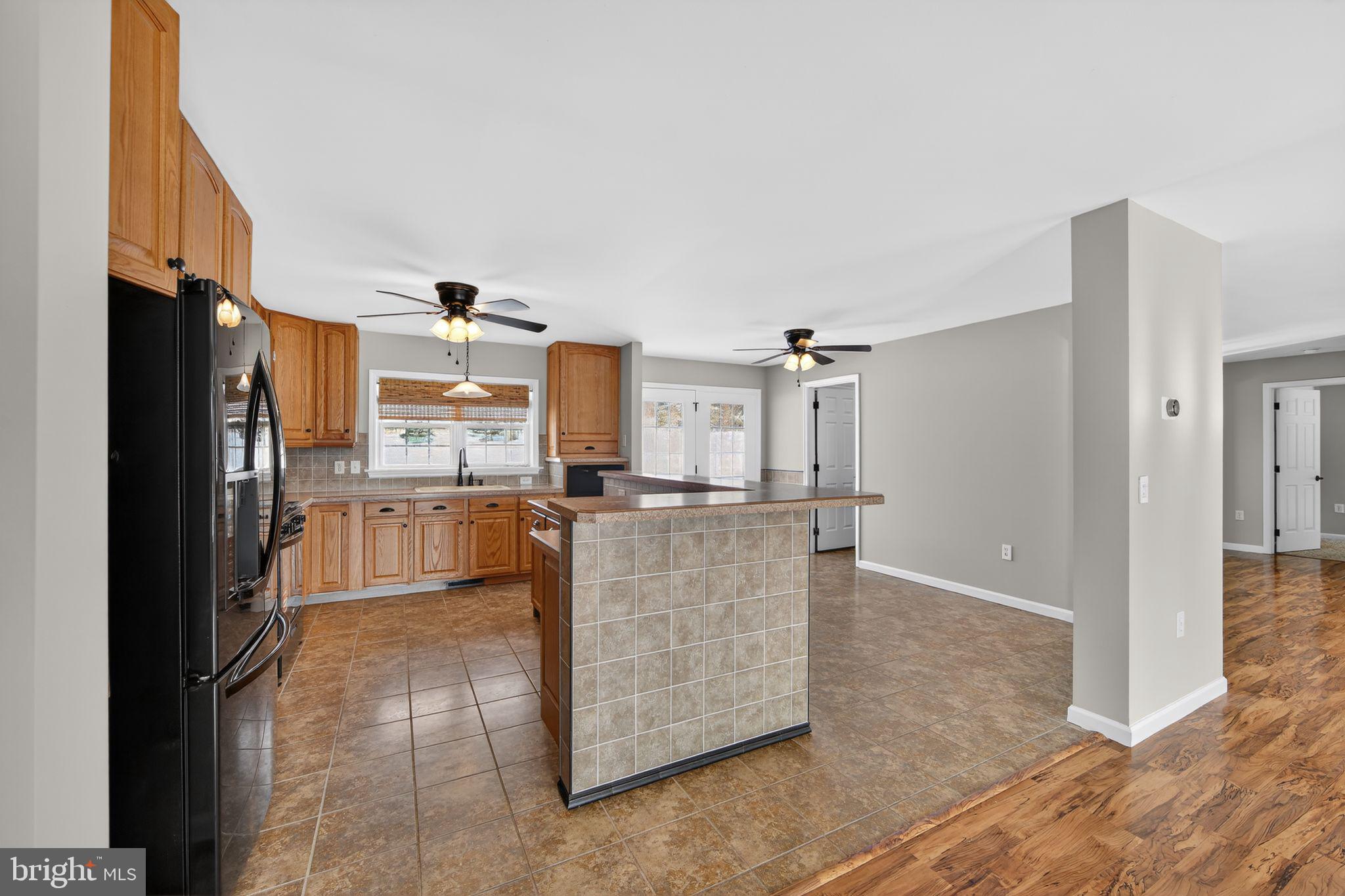 3211 Coventryville Road Pottstown, PA 19465 - Photo 11 of 37 a kitchen with stainless steel appliances granite countertop a refrigerator and a stove