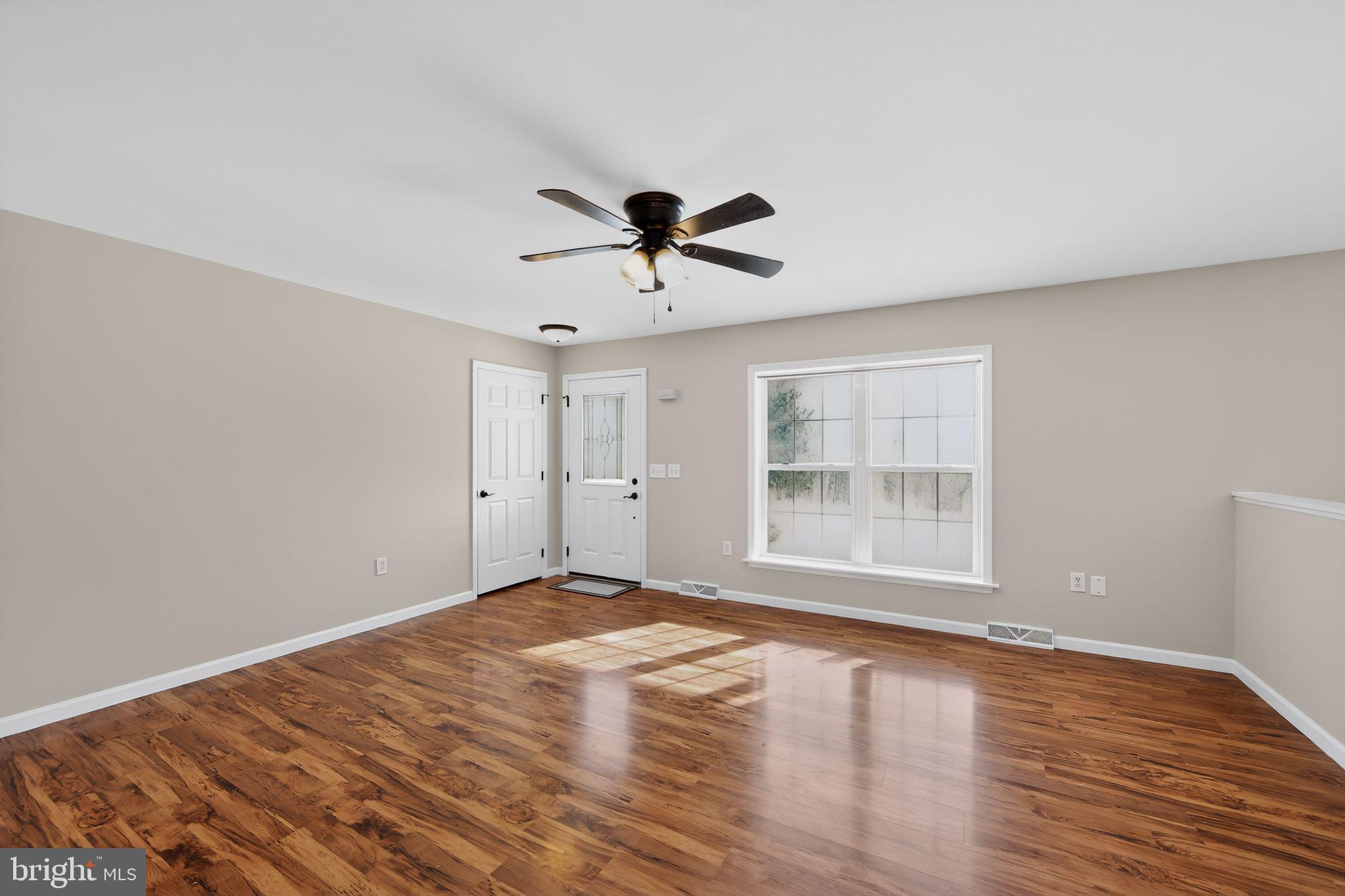 3211 Coventryville Road Pottstown, PA 19465 - Photo 12 of 37 wooden floor in an empty room with a window