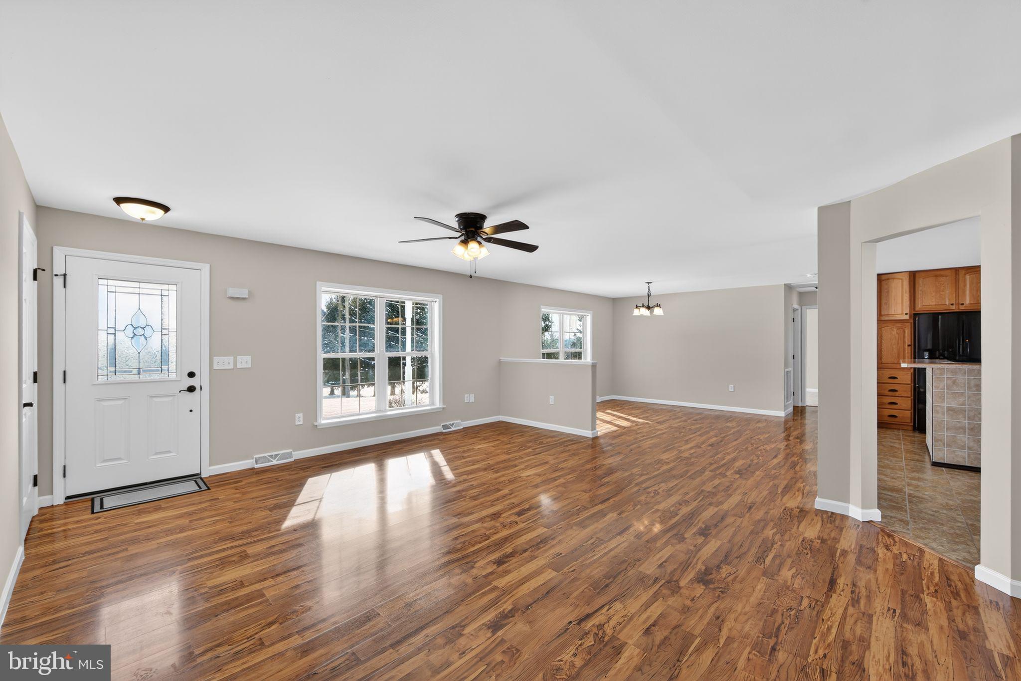 3211 Coventryville Road Pottstown, PA 19465 - Photo 13 of 37 a view of an empty room with wooden floor and a window