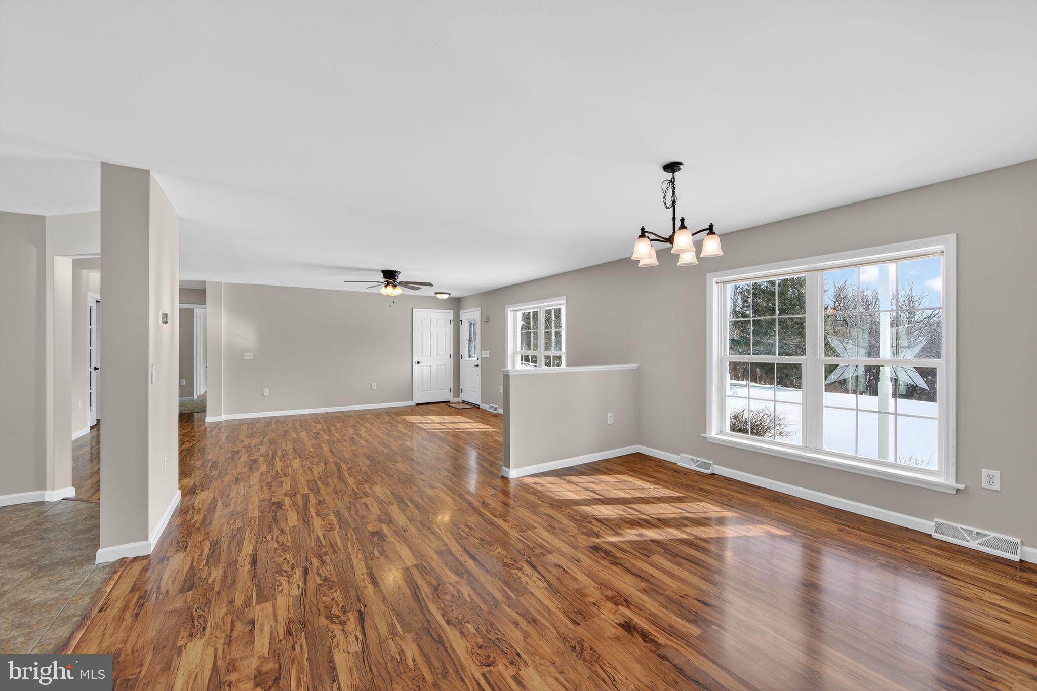 3211 Coventryville Road Pottstown, PA 19465 - Photo 2 of 37 a view of empty room with wooden floor and fan