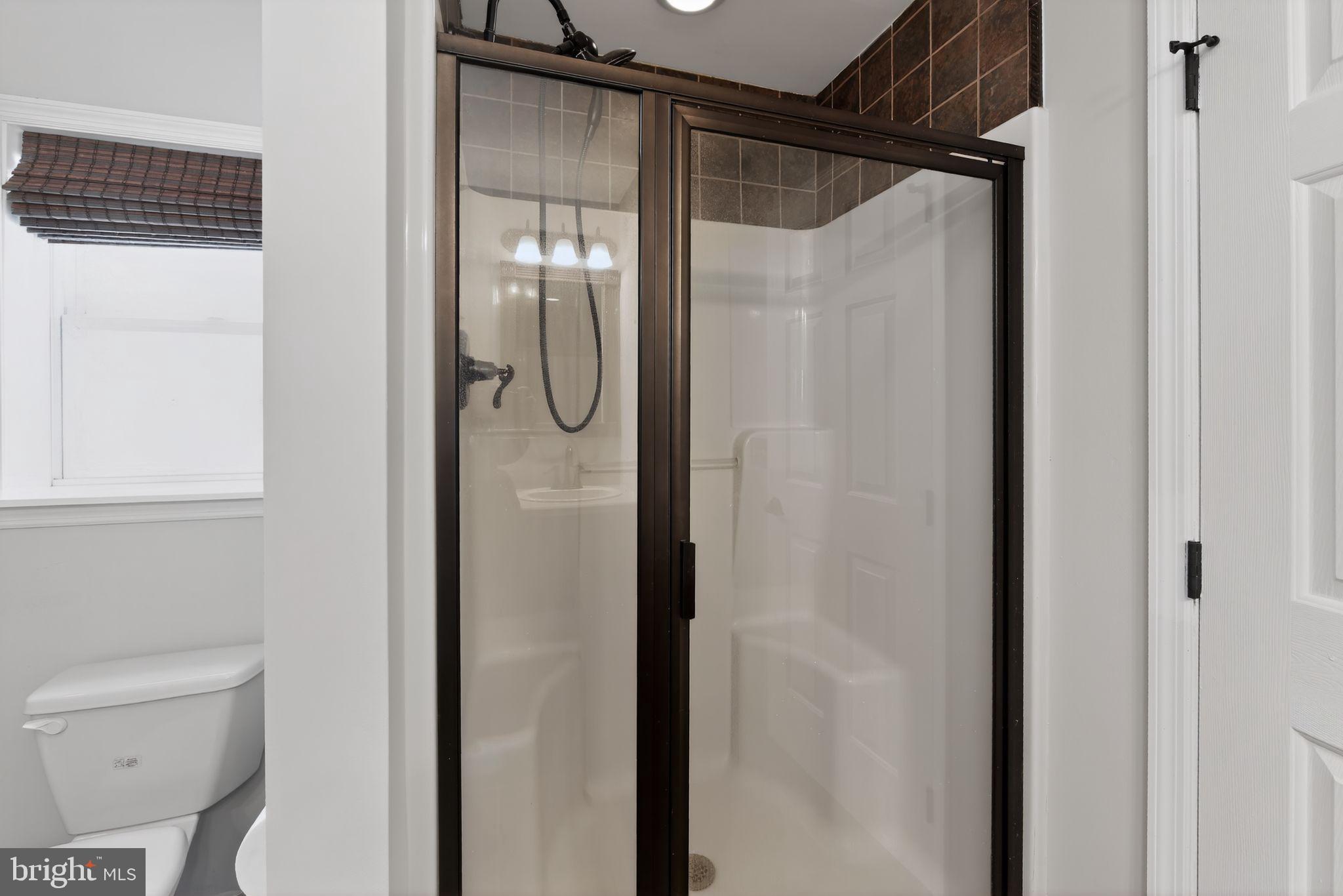 3211 Coventryville Road Pottstown, PA 19465 - Photo 22 of 37 a bathroom with a shower and a toilet