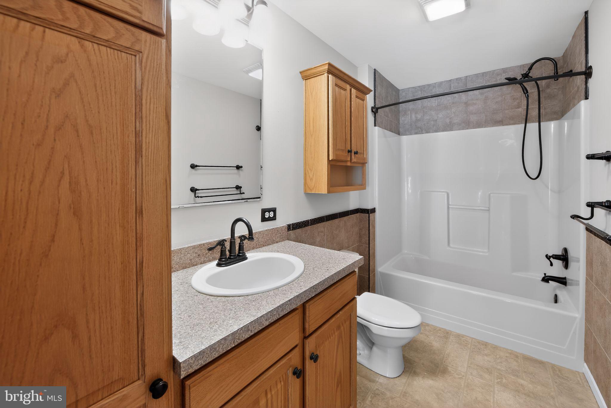 3211 Coventryville Road Pottstown, PA 19465 - Photo 25 of 37 a bathroom with a sink a toilet and shower