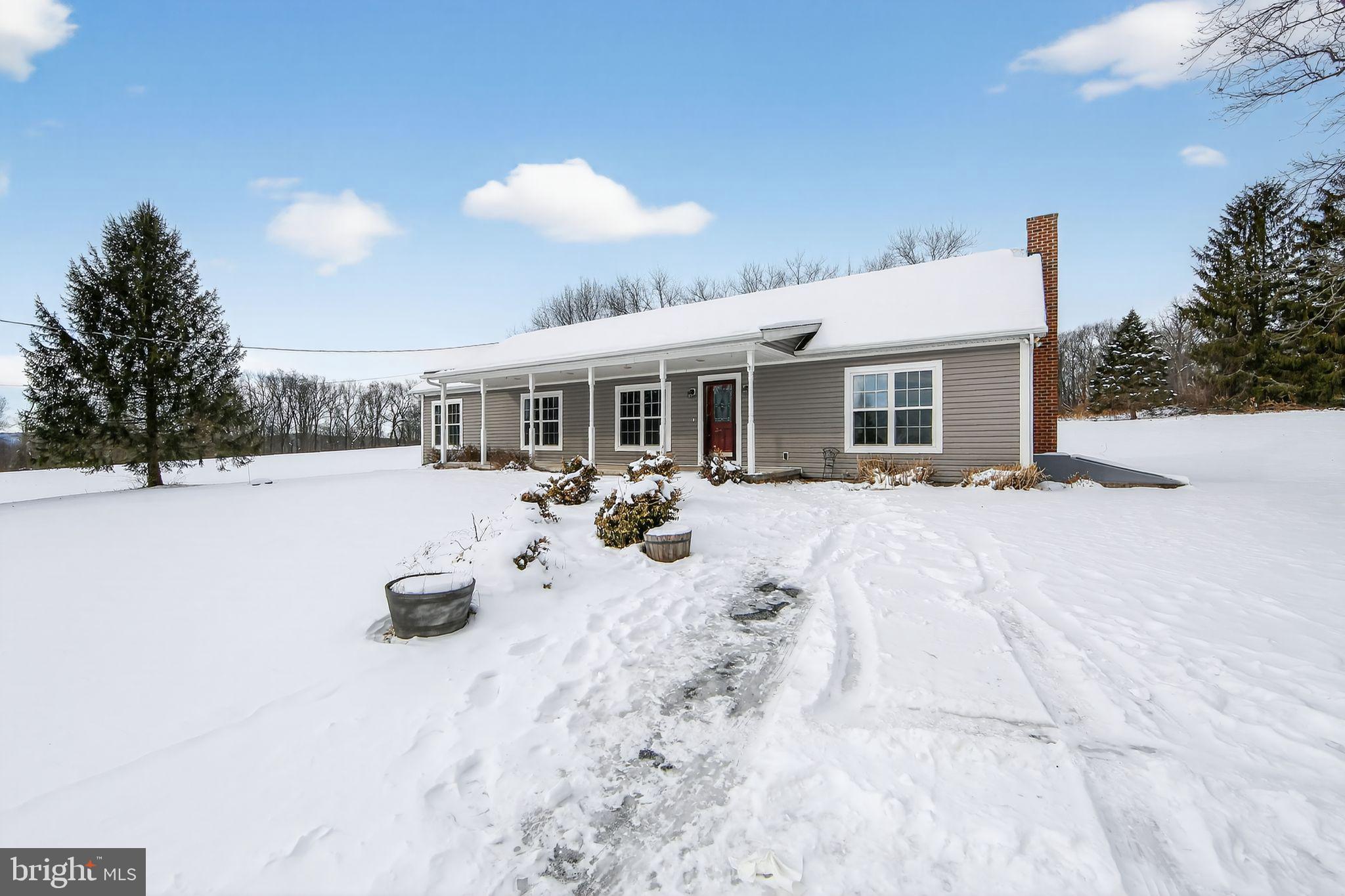 3211 Coventryville Road Pottstown, PA 19465 - Photo 29 of 37 a view of a white house with yard porch and sitting area