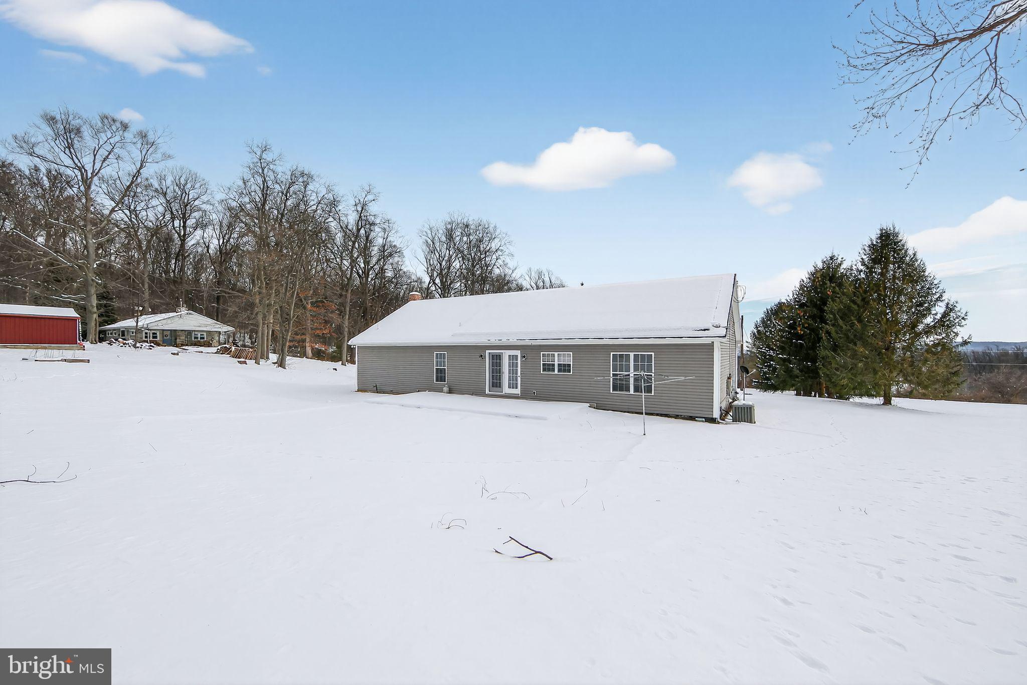 3211 Coventryville Road Pottstown, PA 19465 - Photo 31 of 37 a view of a house with a snow in the yard