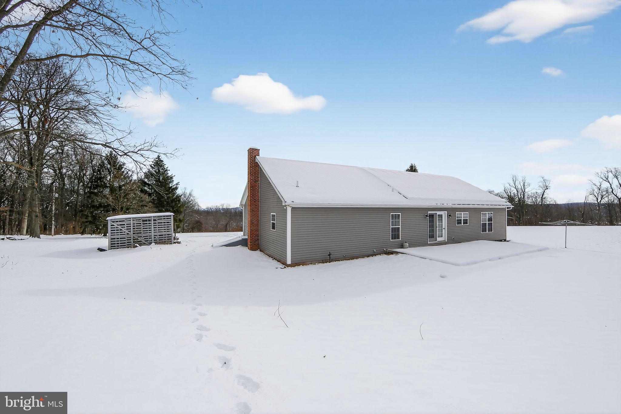 3211 Coventryville Road Pottstown, PA 19465 - Photo 32 of 37 a front view of a house with a yard