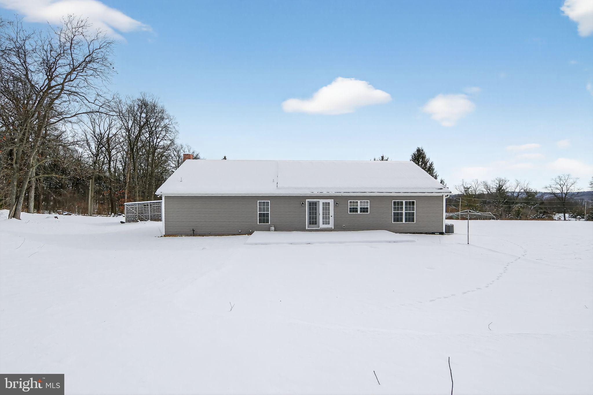 3211 Coventryville Road Pottstown, PA 19465 - Photo 33 of 37 a view of a house with a snow in the yard
