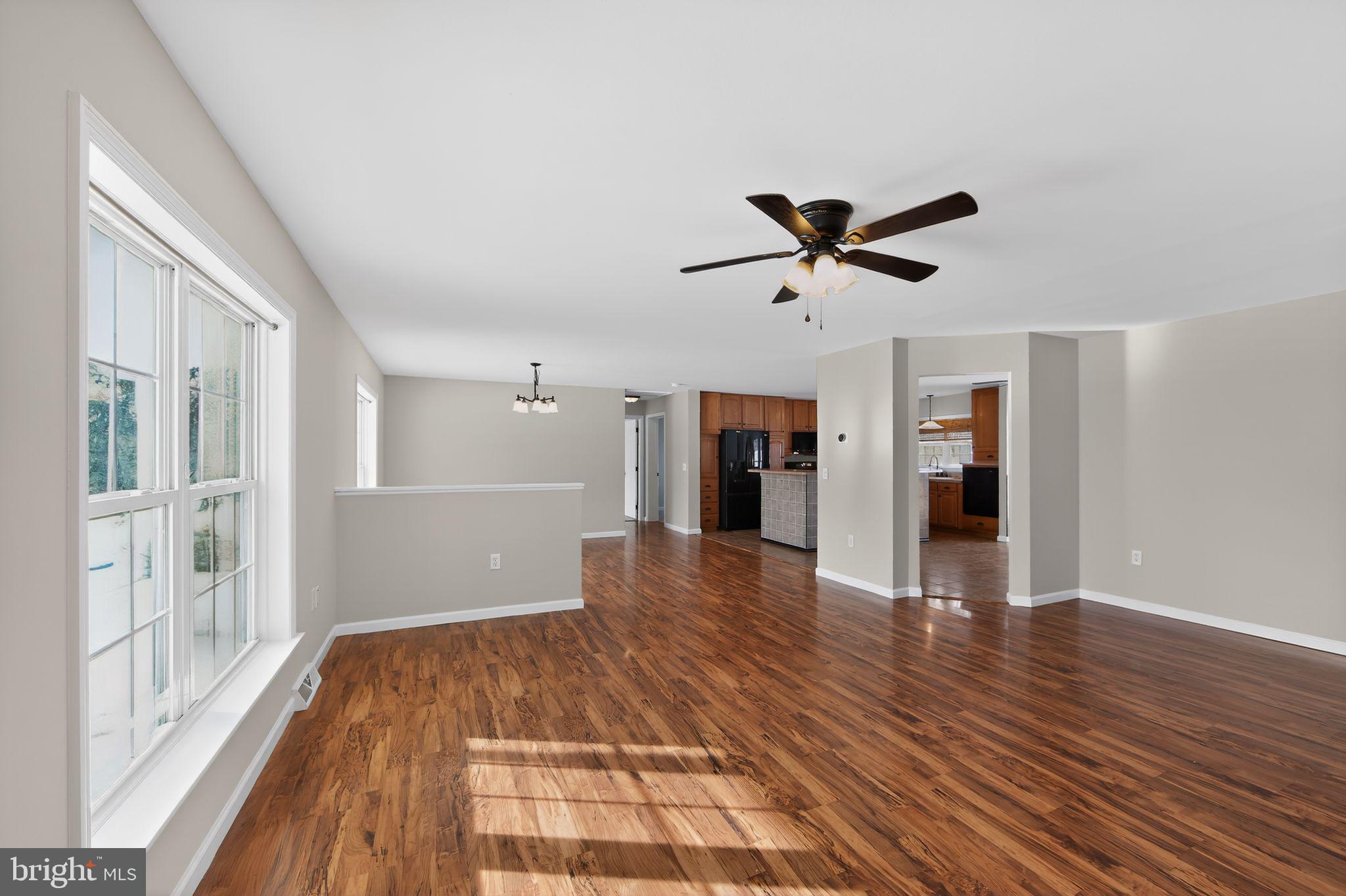 3211 Coventryville Road Pottstown, PA 19465 - Photo 4 of 37 wooden floor in an empty room with a window