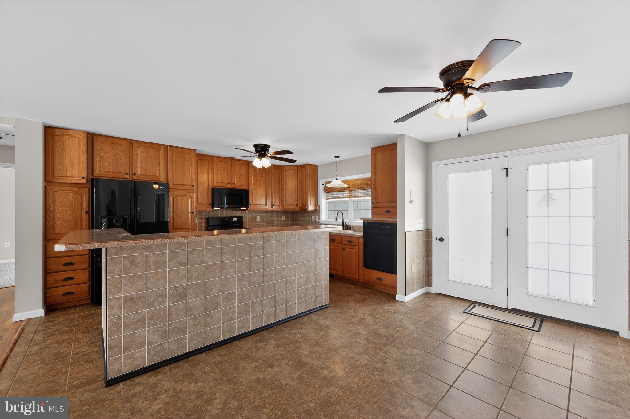 3211 Coventryville Road Pottstown, PA 19465 - Photo 5 of 37 a living room with furniture and a flat screen tv