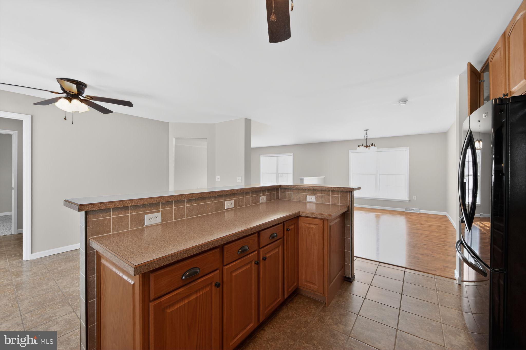 3211 Coventryville Road Pottstown, PA 19465 - Photo 6 of 37 a kitchen with a refrigerator and a sink