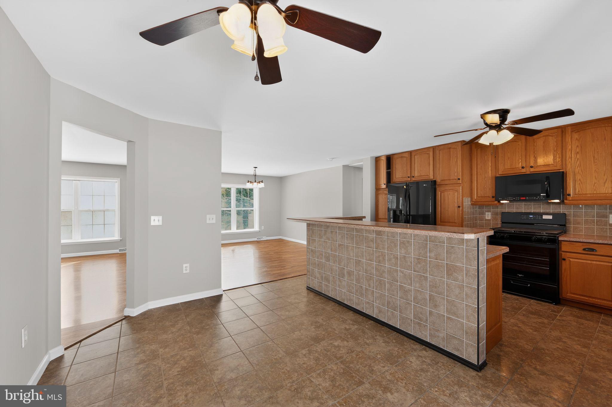 3211 Coventryville Road Pottstown, PA 19465 - Photo 9 of 37 a living room with furniture and a flat screen tv