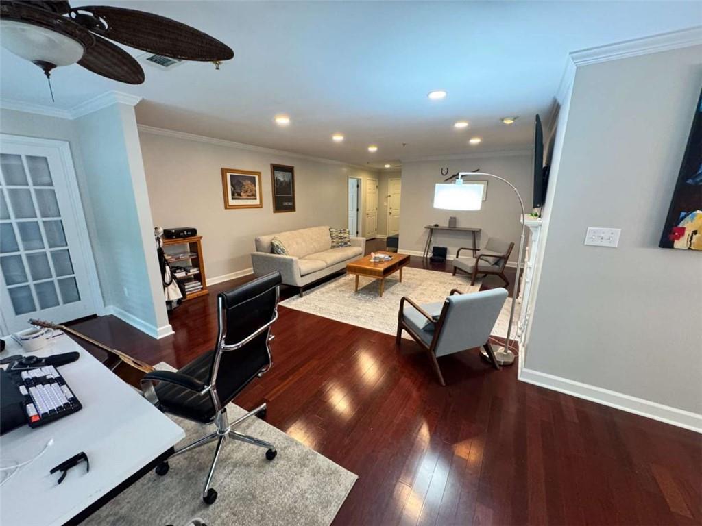 3201 Lenox Road Northeast, Unit 2 Atlanta, GA 30324 - Photo 5 of 39 a living room with furniture and a wooden floor