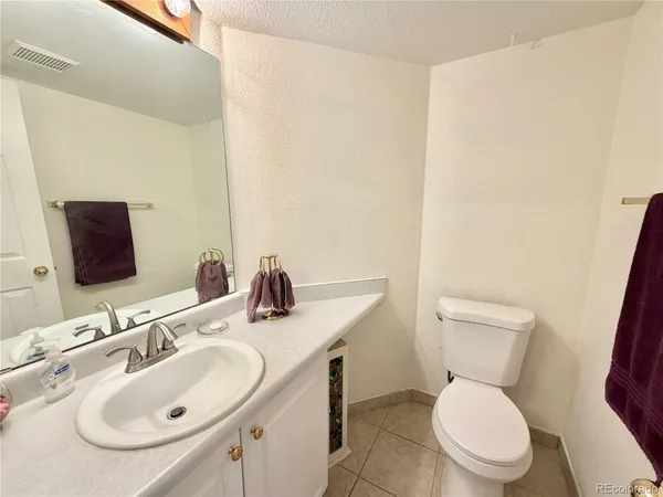 a view of a storage & utility room with wooden floor washer and dryer