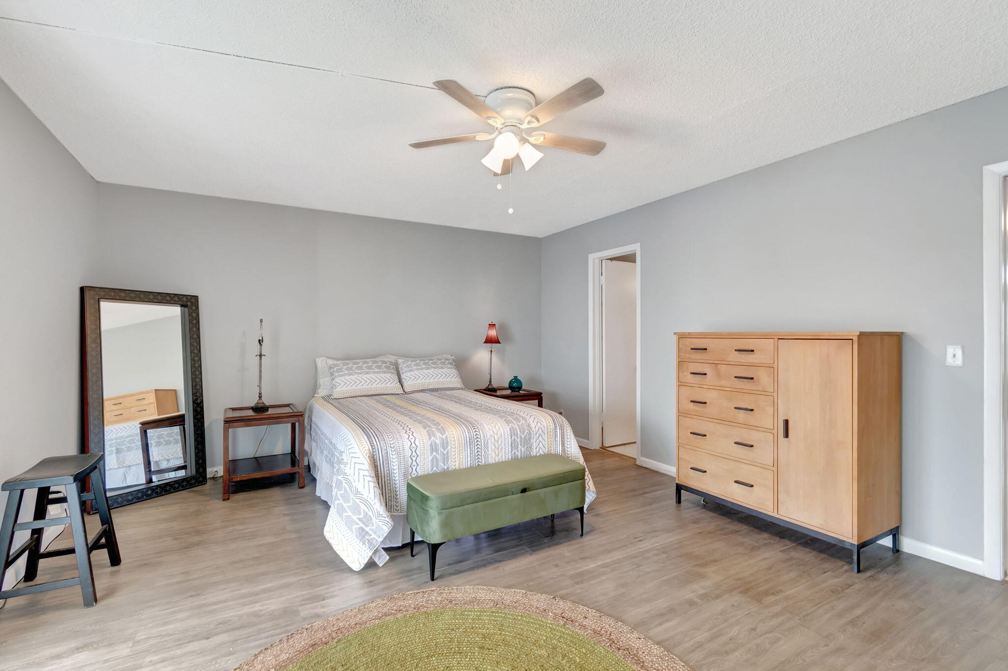 3031 Cornwall East Boca Raton, FL 33434 - Photo 17 of 84 a bedroom with a bed and a chandelier