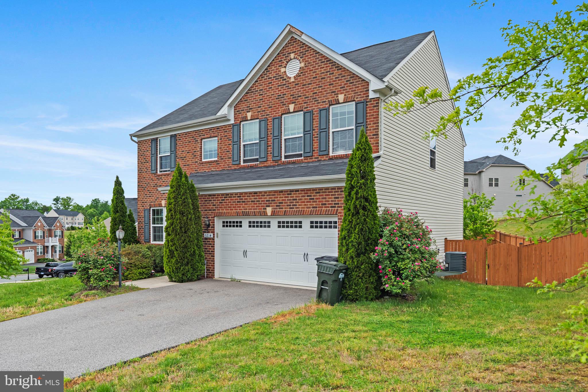3214 Fledgling Circle Woodbridge, VA 22193 - Photo 5 of 29 Charming brick home with lush greenery.