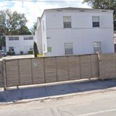 a view of a house with a parking space