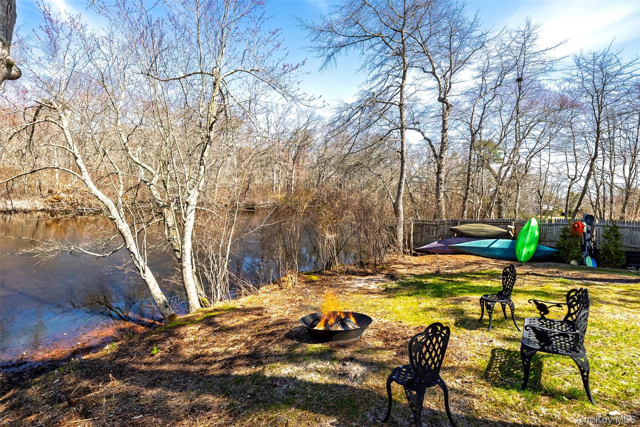 371 South River Road Calverton, NY 11933 - Photo 37 of 43 View of yard with a fire pit and fence