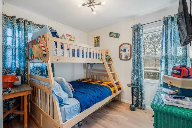 a bathroom with a sink a toilet and shower curtain