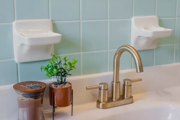 a view of a house with a yard and a wooden deck