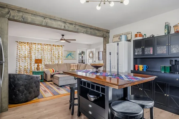 a view of a dining room with furniture and a table