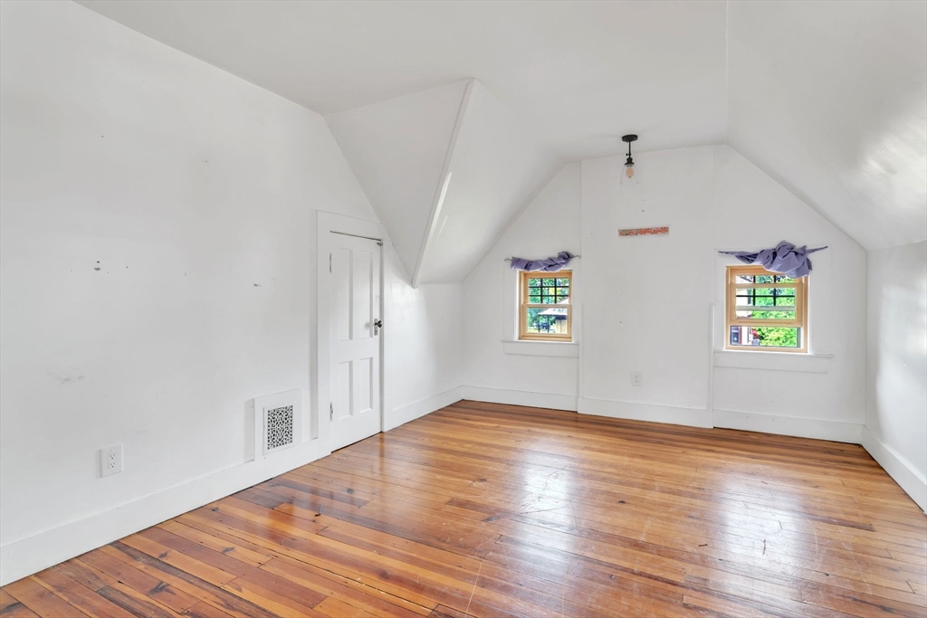 15 Mountainview Street Springfield, MA 01108 - Photo 20 of 30 an empty room with wooden floor and windows