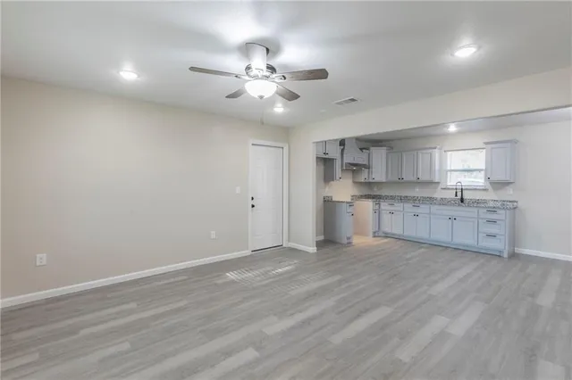 a view of kitchen with wooden floor and window