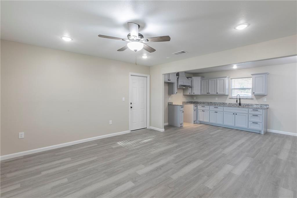 613 North Rita Street Waco, TX 76705 - Photo 6 of 17 a view of kitchen with wooden floor and window