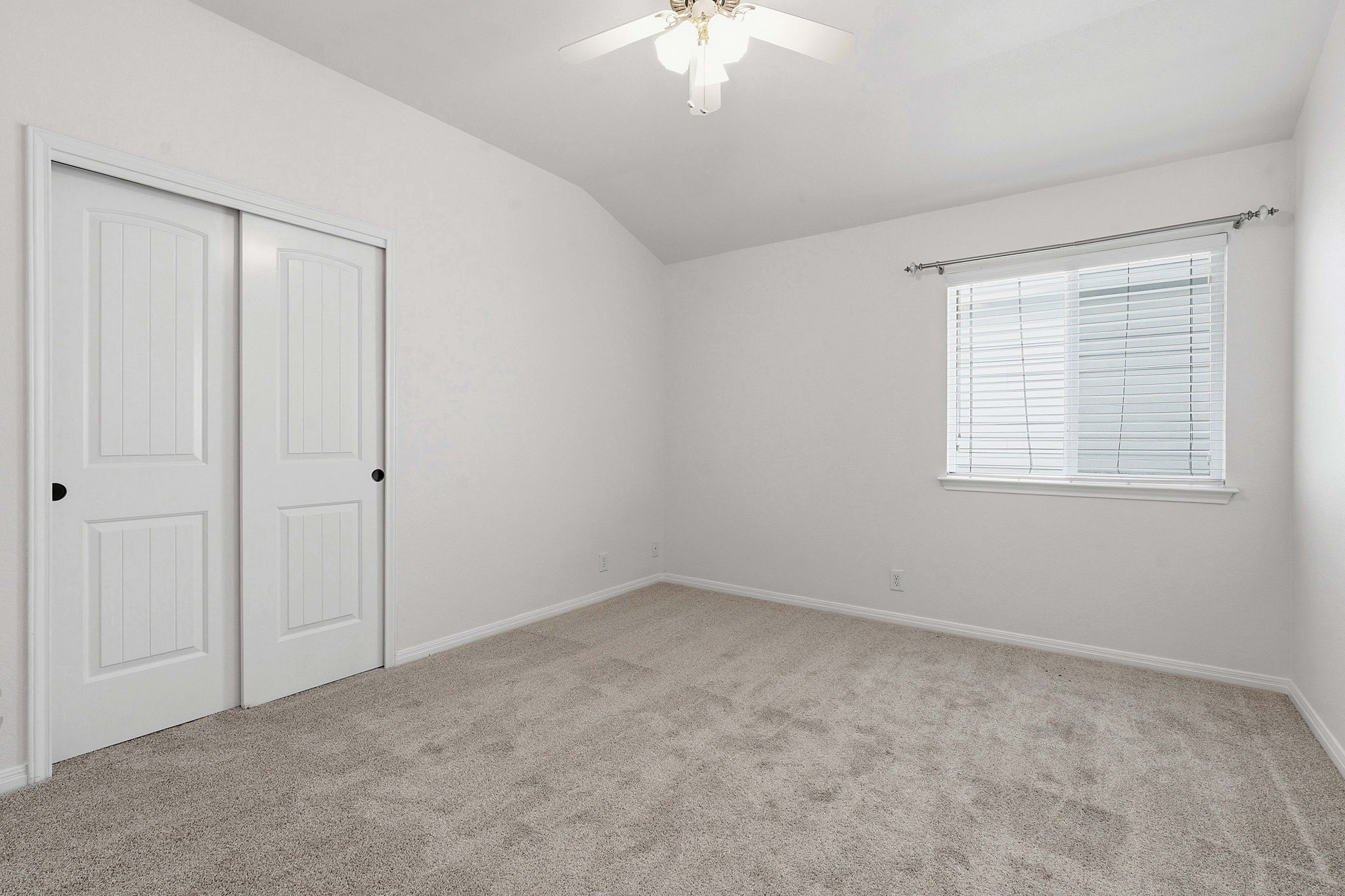8541 Inca Dove Drive Austin, TX 78729 - Photo 20 of 28 One of two comfortable secondary bedrooms, both with closet storage and ceiling fans.