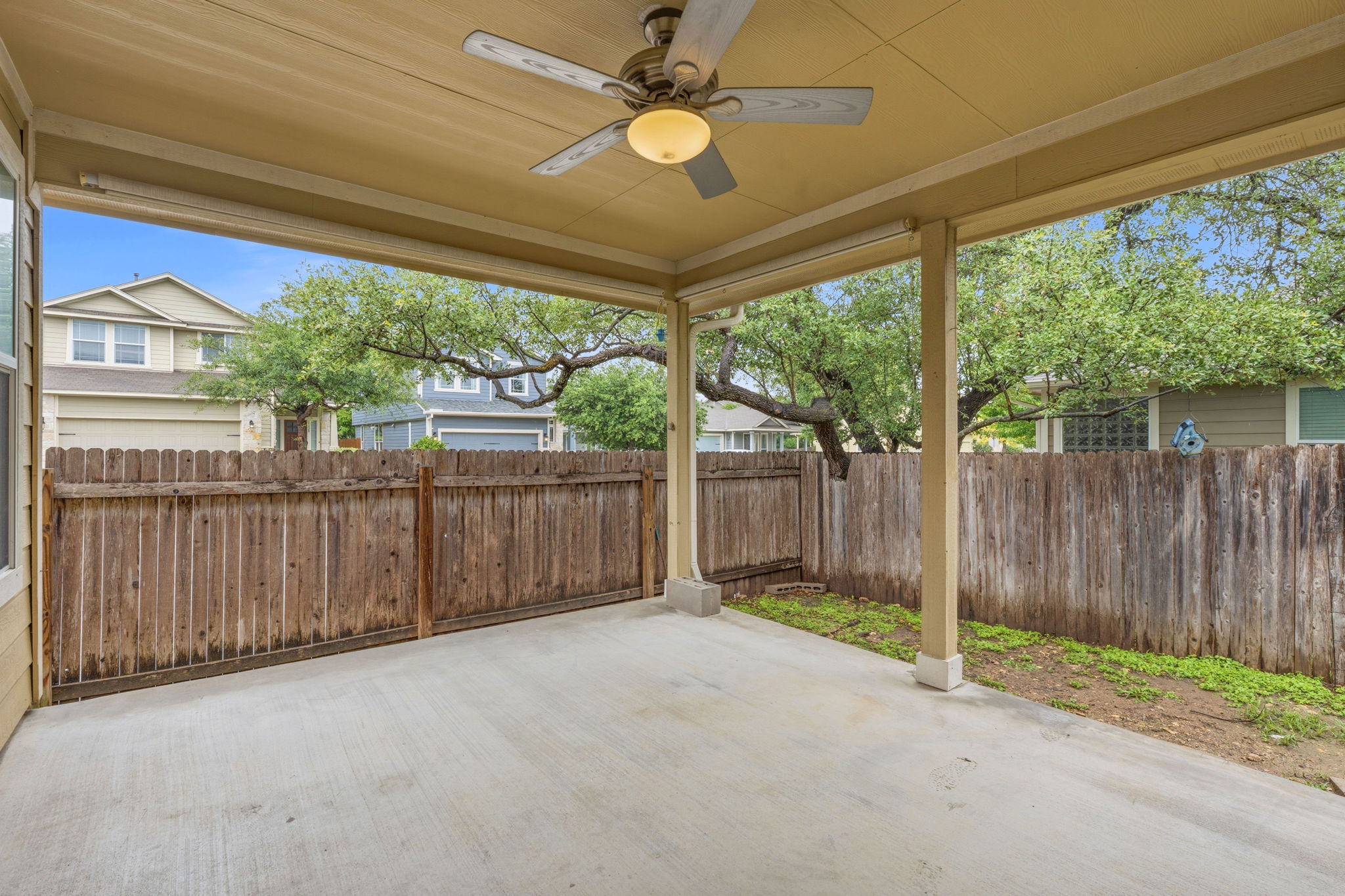 8541 Inca Dove Drive Austin, TX 78729 - Photo 24 of 28 Your living area stretches outdoor onto the breeze covered back porch with overhead fan.