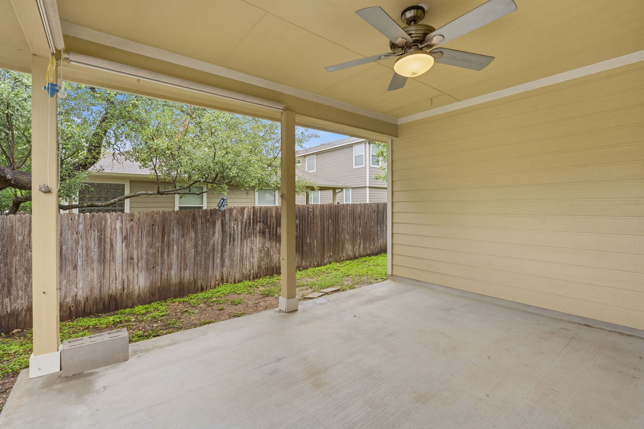 8541 Inca Dove Drive Austin, TX 78729 - Photo 25 of 28 The porch provides space for outdoor living, dining, and your grill station.
