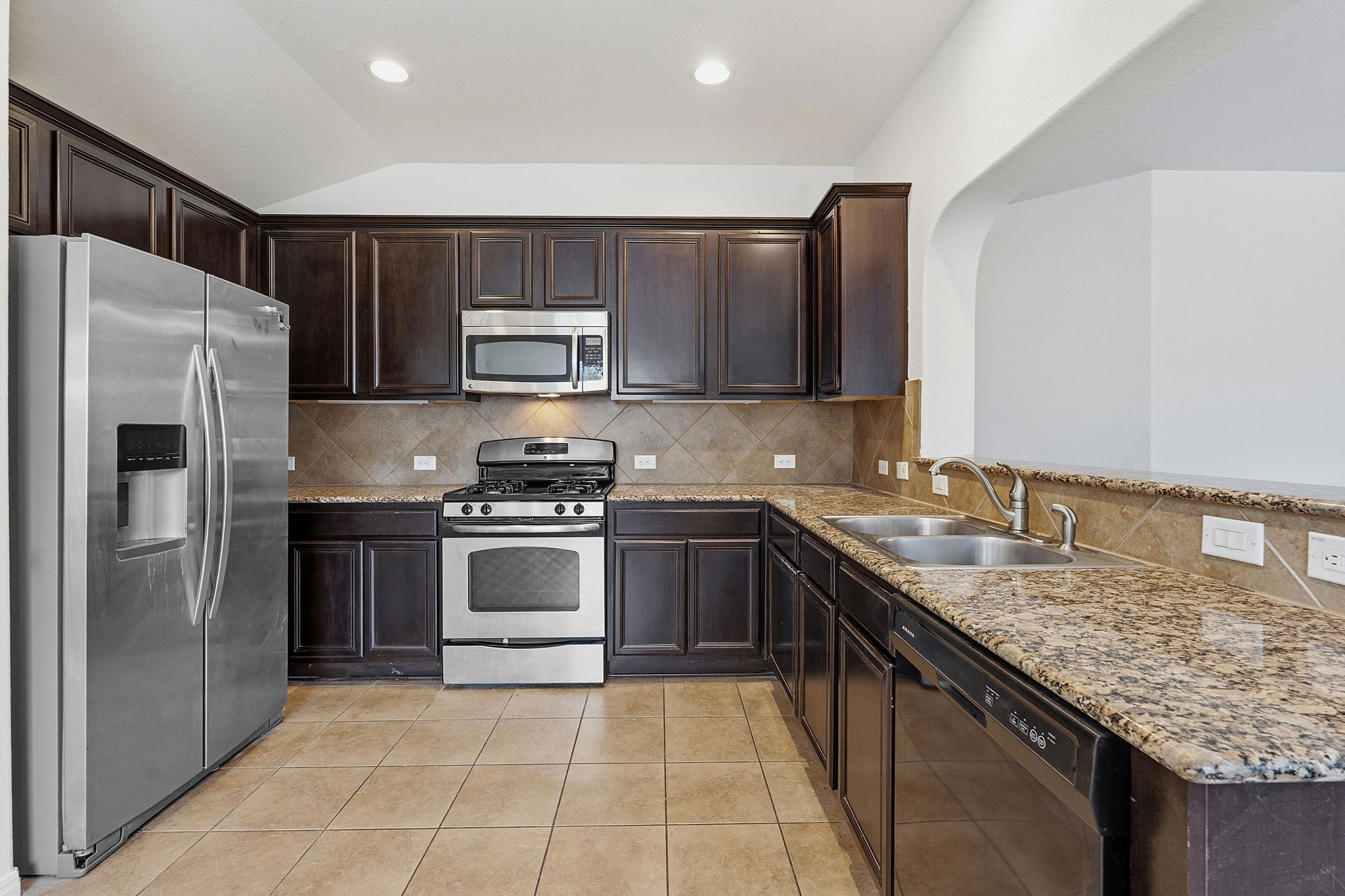 8541 Inca Dove Drive Austin, TX 78729 - Photo 3 of 28 The kitchen comes ready to use with desirable contemporary finishes.
