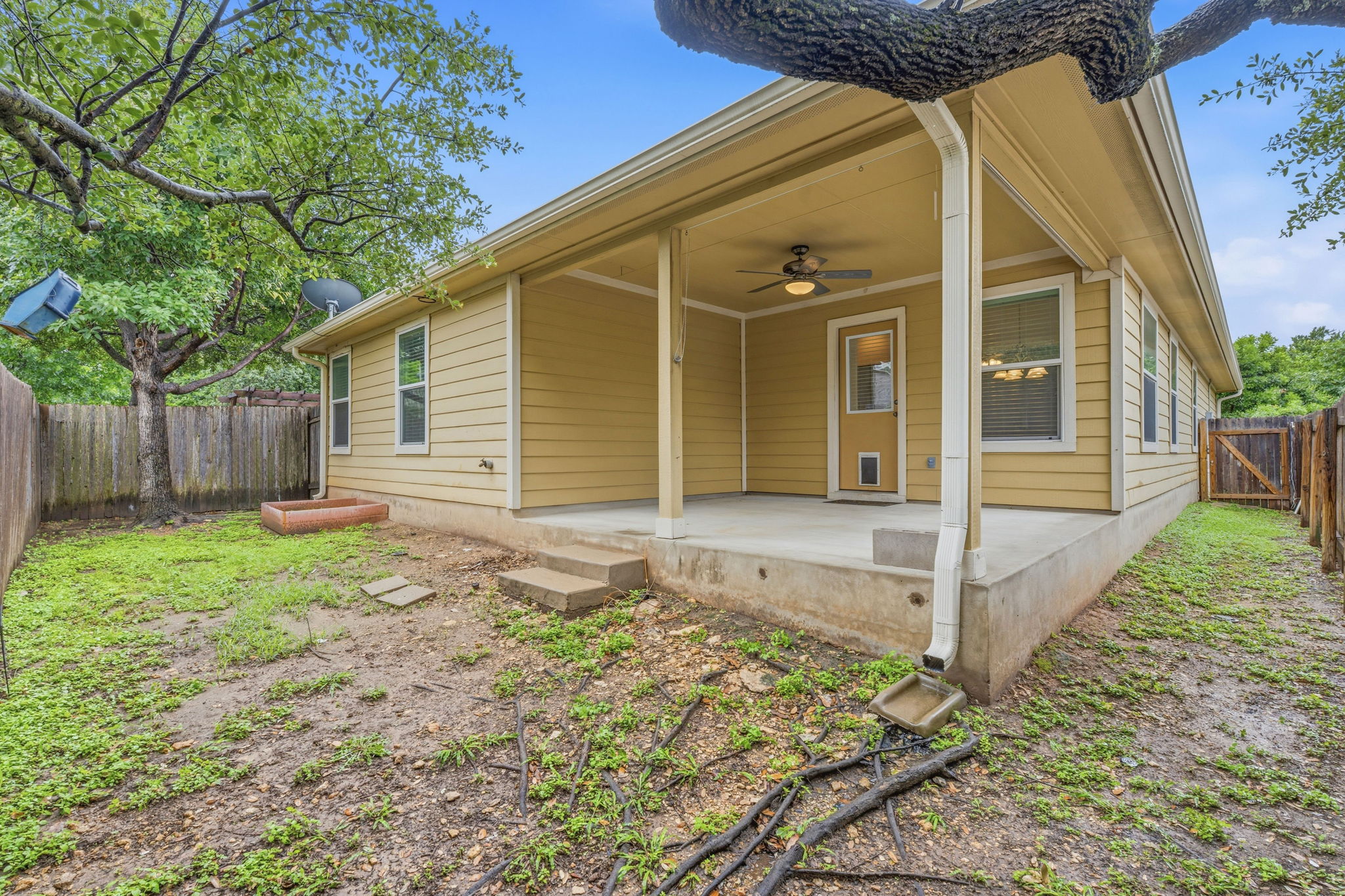 8541 Inca Dove Drive Austin, TX 78729 - Photo 5 of 28 Enjoy your own private fenced-in backyard with a large covered porch for outdoor living.