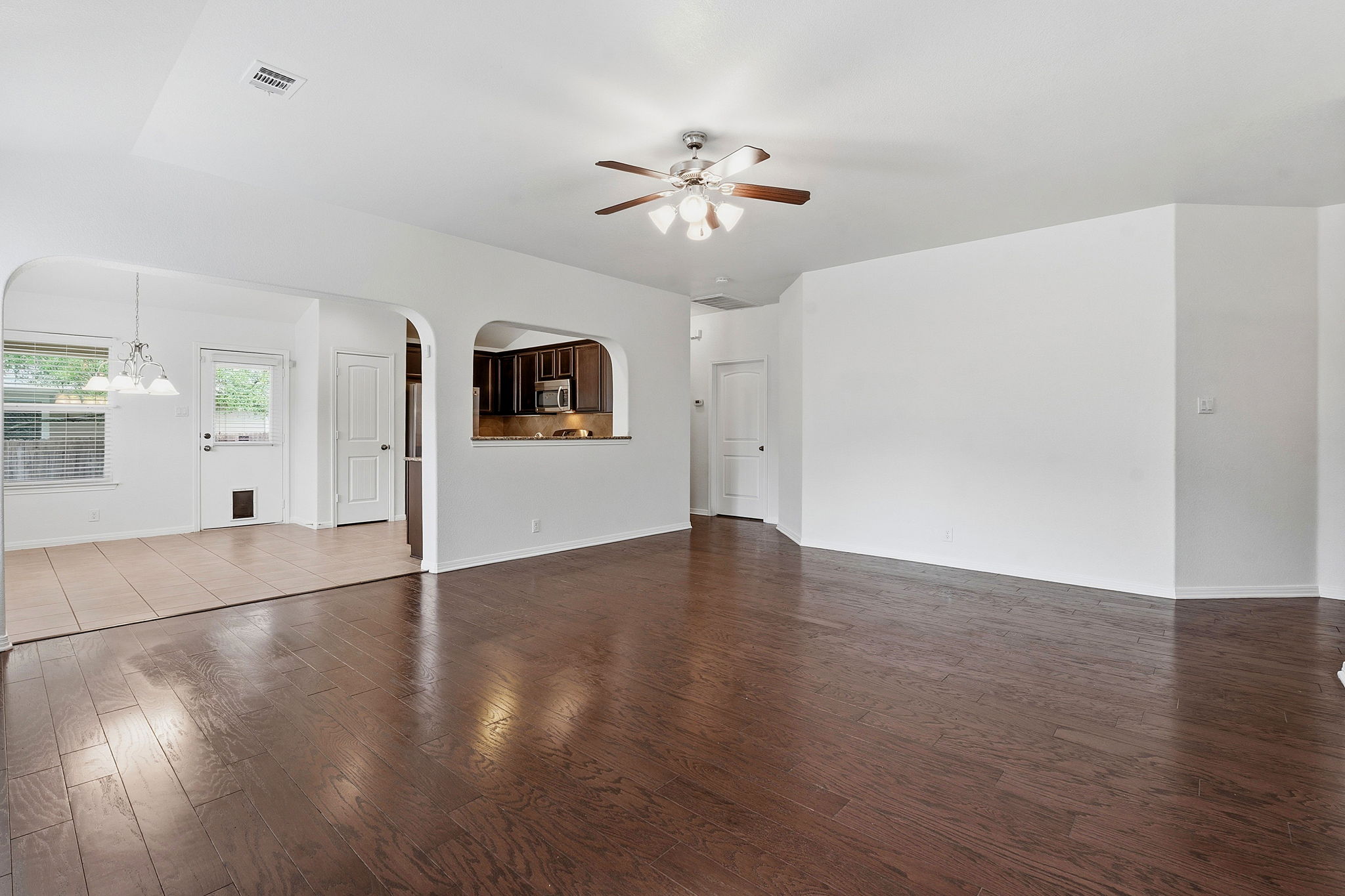 8541 Inca Dove Drive Austin, TX 78729 - Photo 7 of 28 Spacious living room with ample space to stretch out and configure spaces for gathering, media, music, play and more.