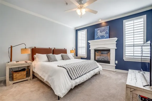 a bedroom with a bed and a fireplace