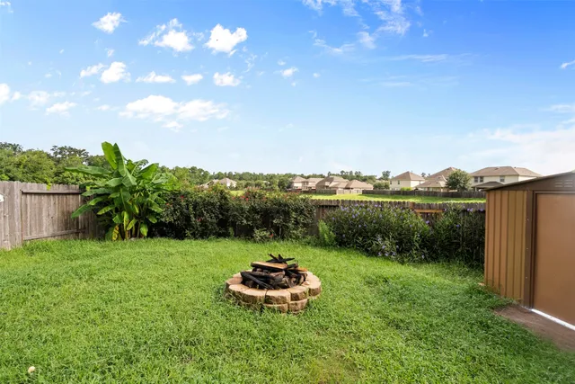a big yard with lots of green space and plants