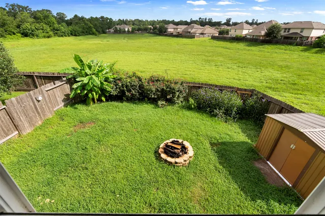 a view of a lake with a yard