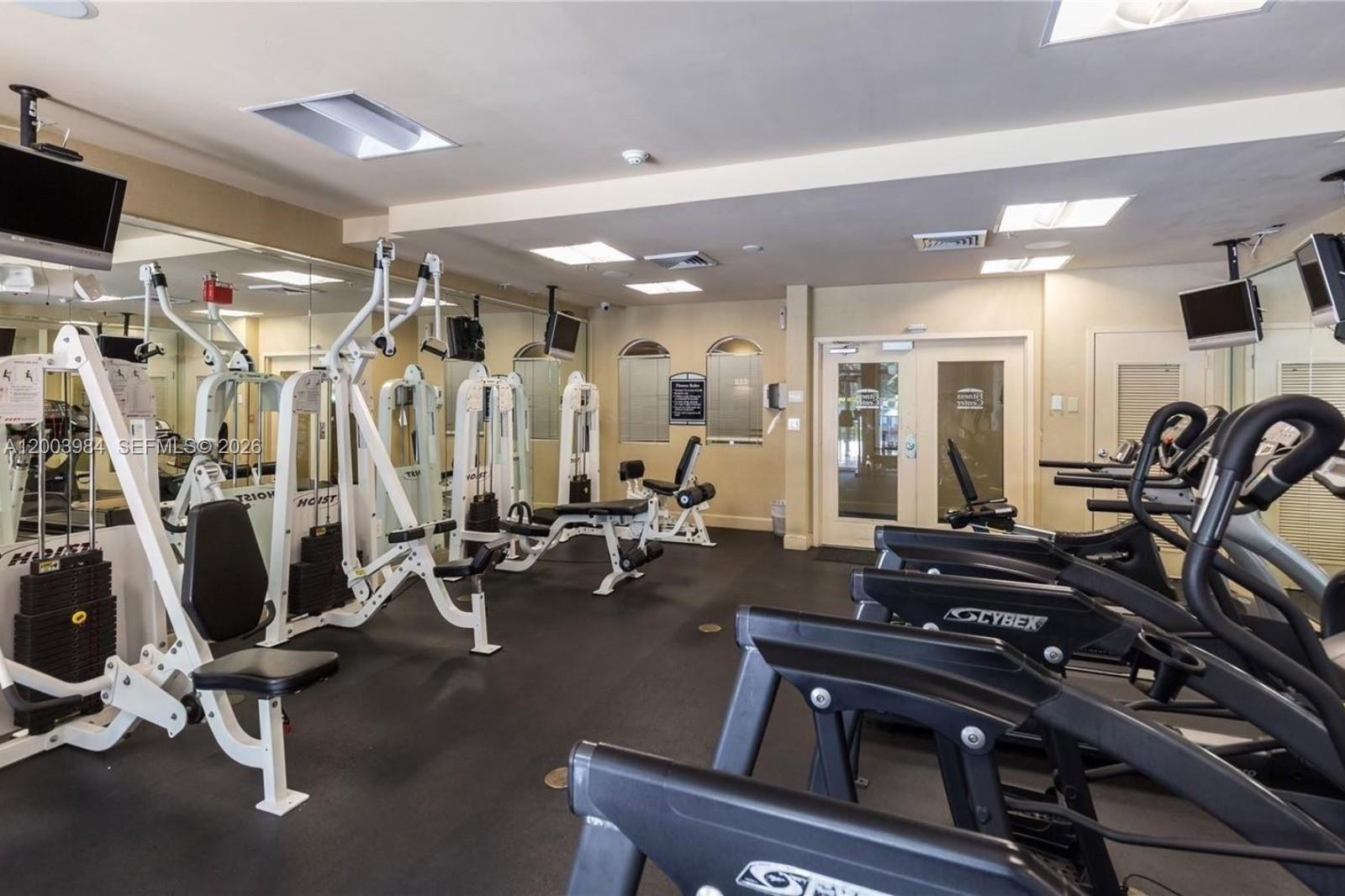 6001 Southwest 70th Street, Unit 342 South Miami, FL 33143 - Photo 11 of 19 a view of a room with gym equipment