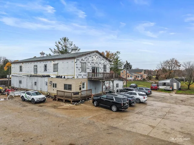 a view of a cars park in front of house