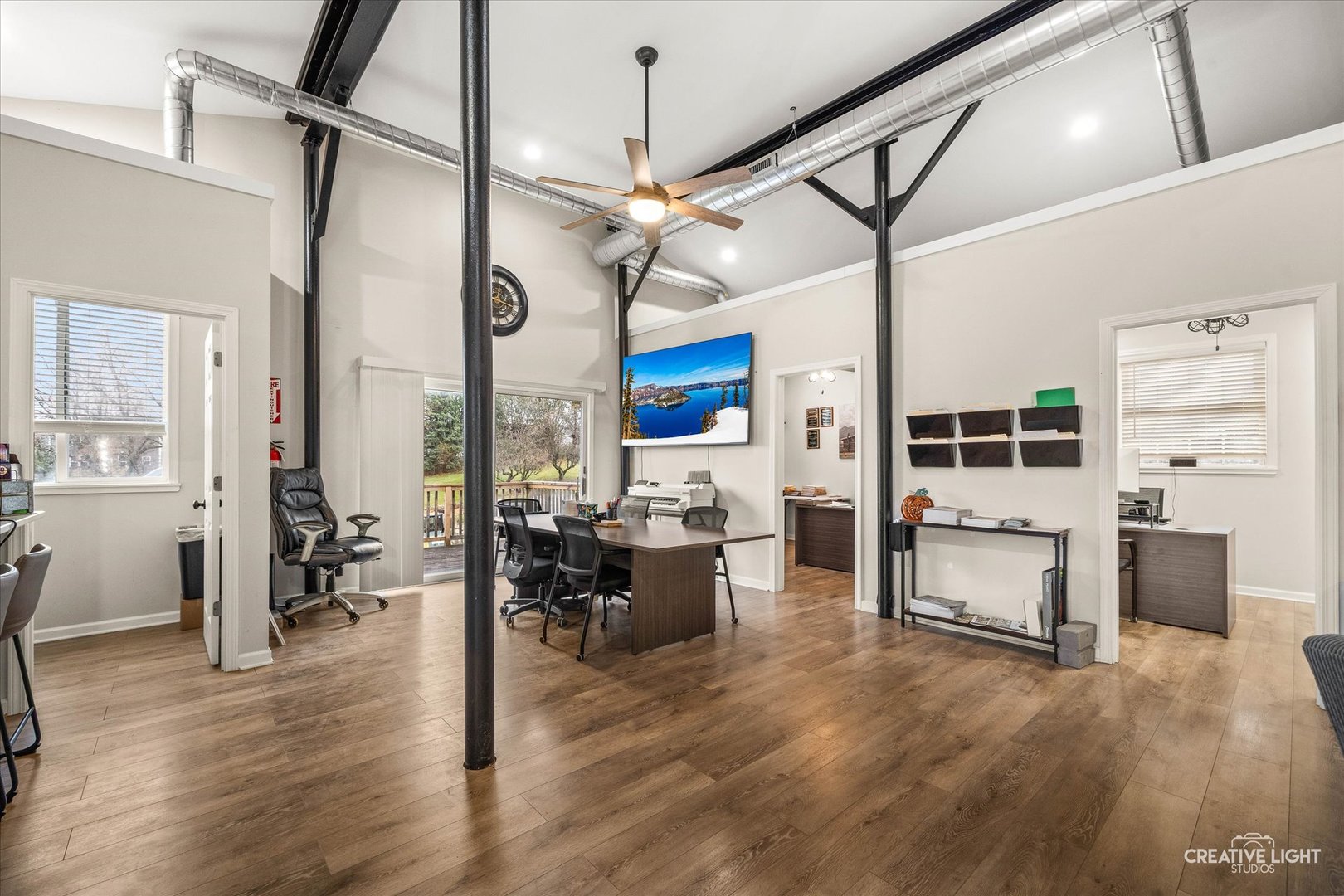3711 West Algonquin Road Algonquin, IL 60102 - Photo 16 of 21 a living room with furniture a dining table wooden floor and a fireplace