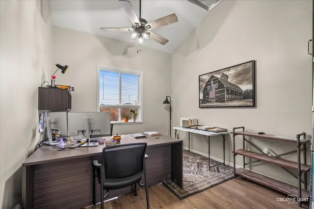 a view of a workspace with furniture