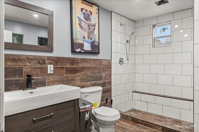 a bathroom with a sink toilet and shower