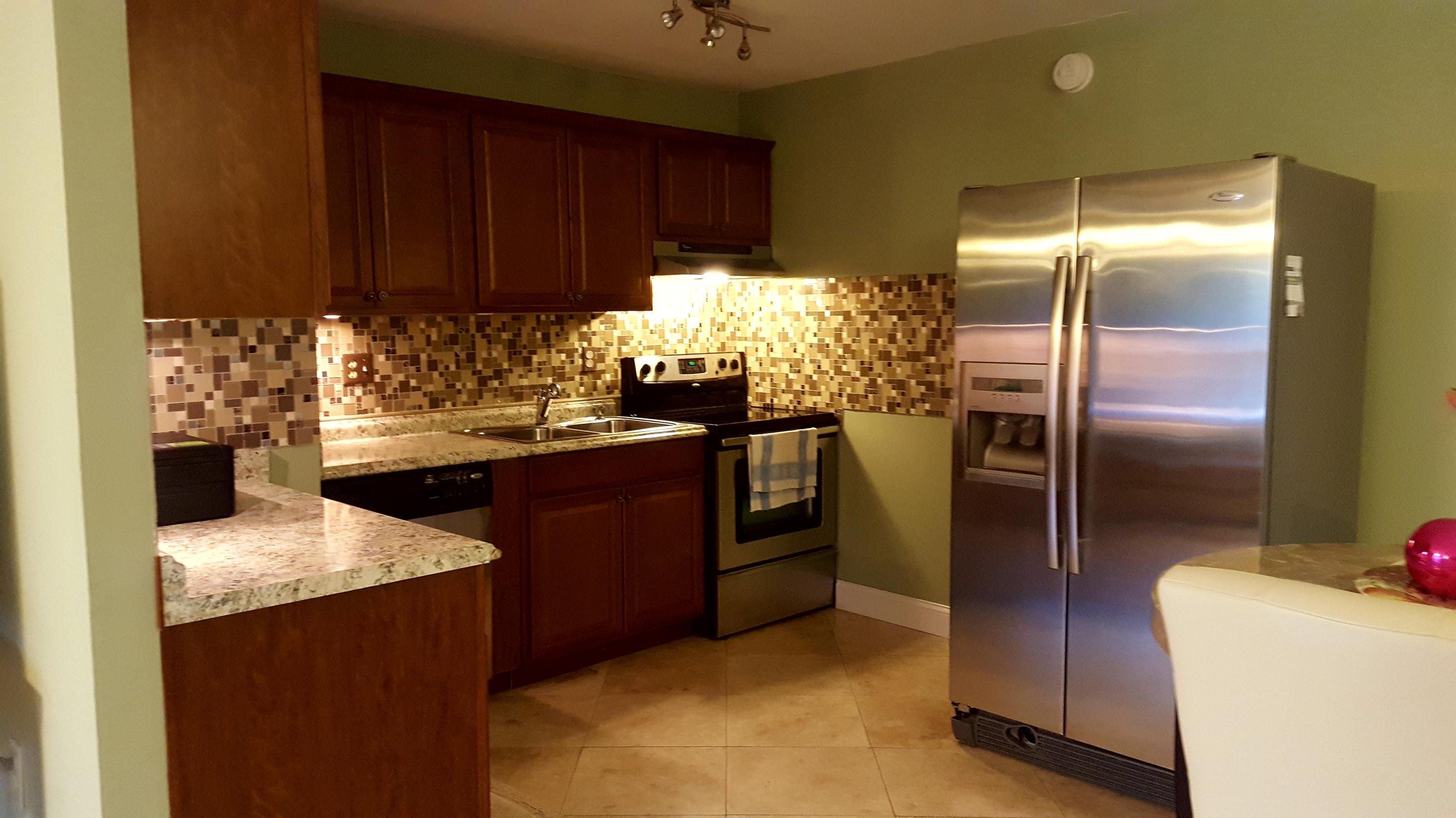 17999 41st Road North Loxahatchee, FL 33470 - Photo 11 of 19 a kitchen with refrigerator and cabinets