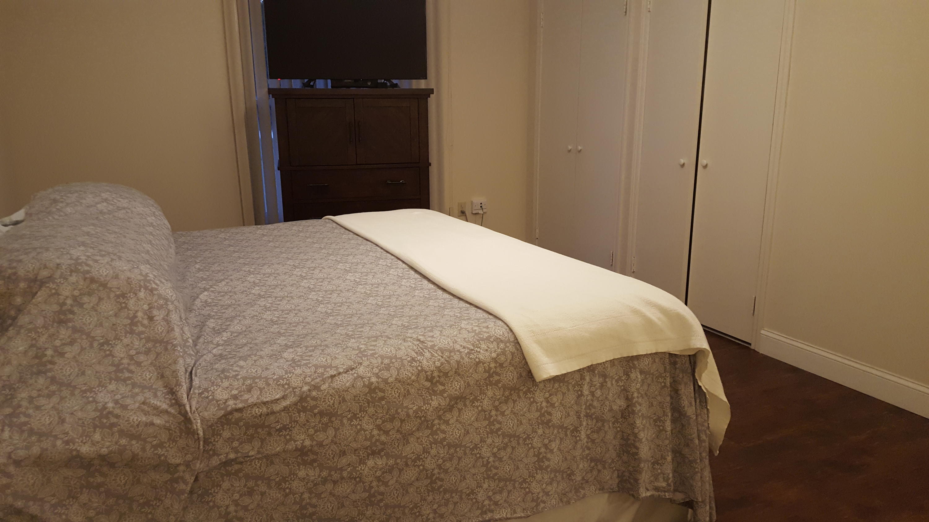 17999 41st Road North Loxahatchee, FL 33470 - Photo 15 of 19 a bed sitting in a bedroom next to a cabinet