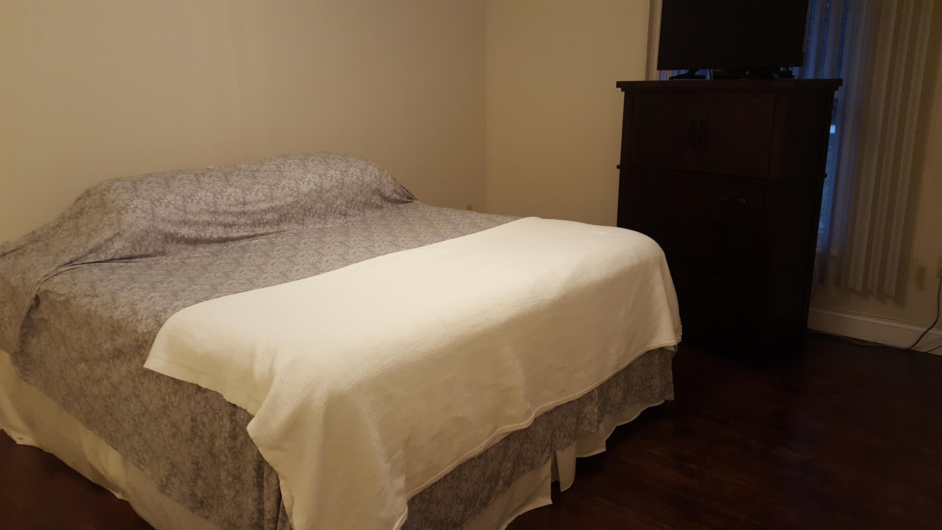 17999 41st Road North Loxahatchee, FL 33470 - Photo 16 of 19 a bed sitting in a bedroom next to a bathroom