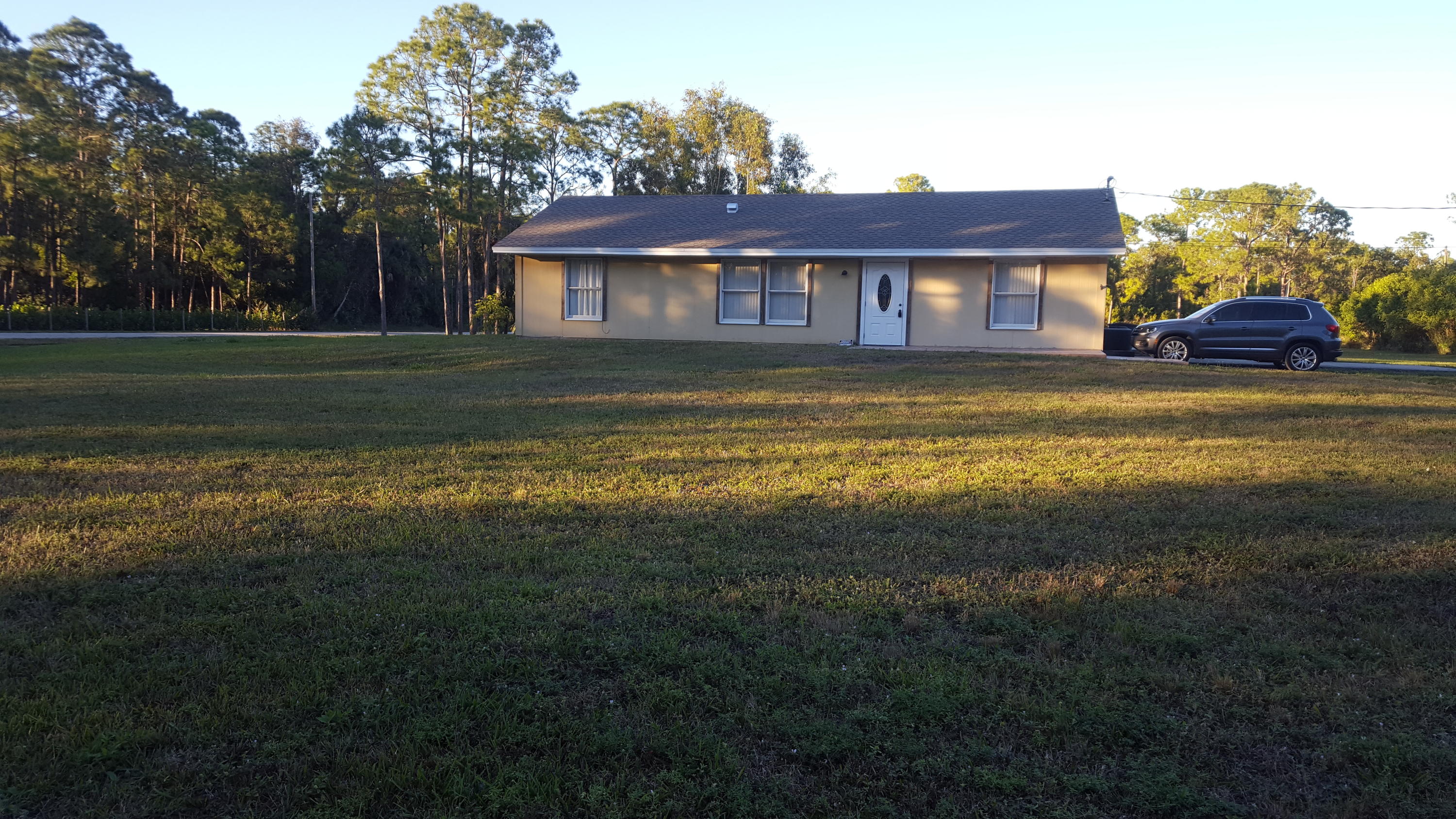 17999 41st Road North Loxahatchee, FL 33470 - Photo 5 of 19 a front view of a house with a yard