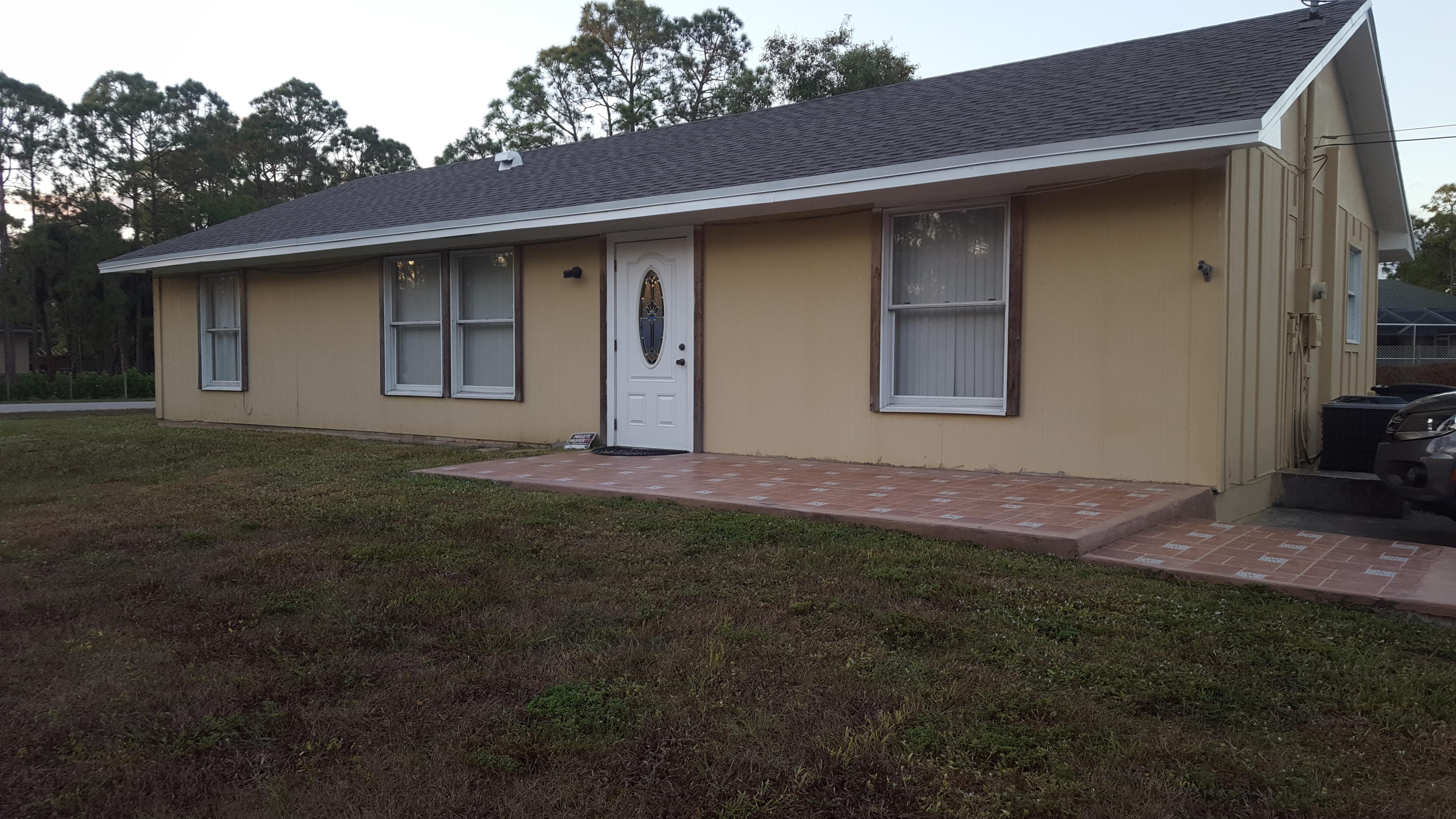 17999 41st Road North Loxahatchee, FL 33470 - Photo 6 of 19 a backyard of a house with lots of green space