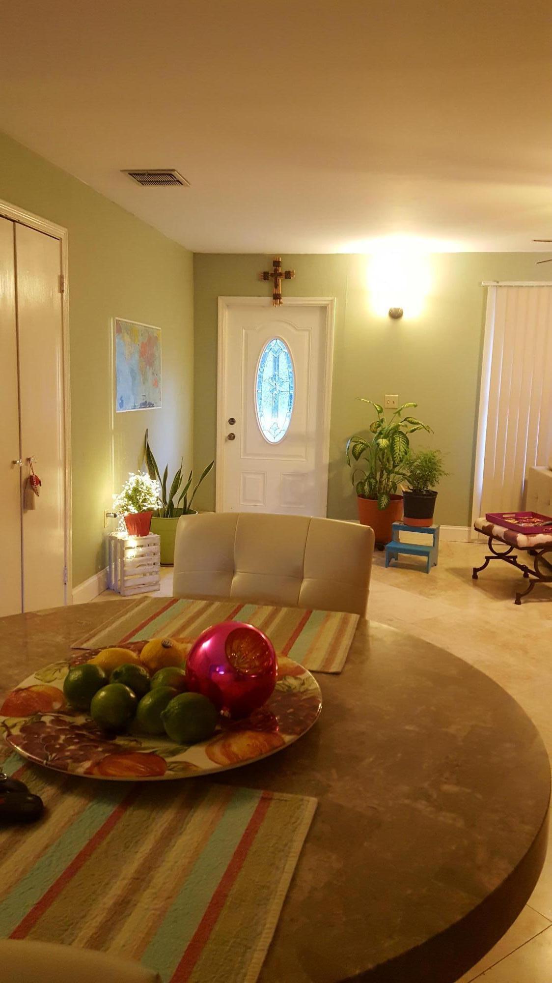17999 41st Road North Loxahatchee, FL 33470 - Photo 8 of 19 a bedroom with a bed and wooden floor